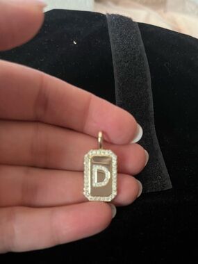 Melinda Maria reversible letter “D” amulet.